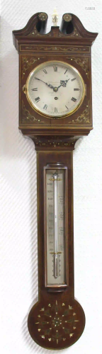 Wall clock with thermometer. 
