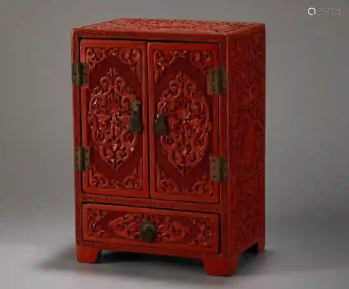 A RED LACQUERED CABINET