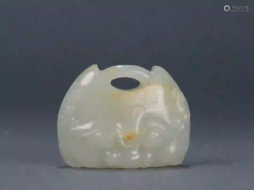 A JADE CARVING OF BEAST MASK