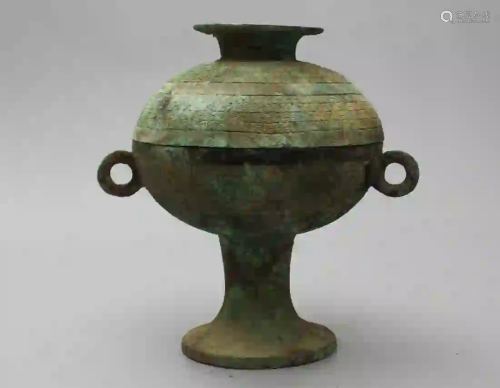 A BRONZE DOU WITH COVER