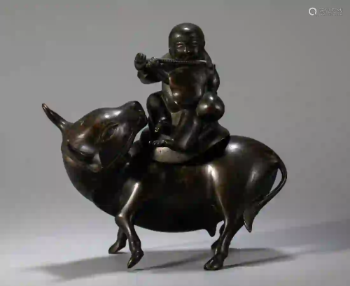 A BRONZE STATUE OF OXHERDING KID