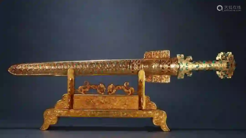 A GOLD AND SILVER INLAID SWORD ORNAMENT