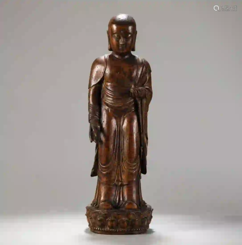A CARVED EAGLEWOOD OF STANDING BUDDHA