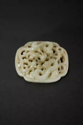 A CREAMY JADE CARVING OF DOUBLE CHI-DRAGONS