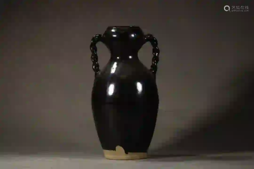 A BLACK GLAZED PORCELAIN JAR WITH TWO HANDLES