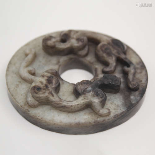 A Double Chi Dragon Carved White Jade Bi