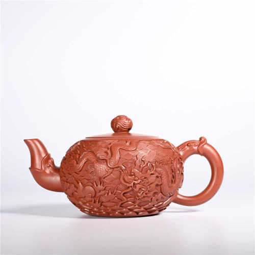 the Qing dynasty         dark-red enameled pottery teapot