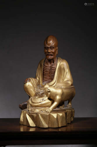 LONGYAN WOOD CARVED AND GILT 'ARHAT' SEATED FIGURE