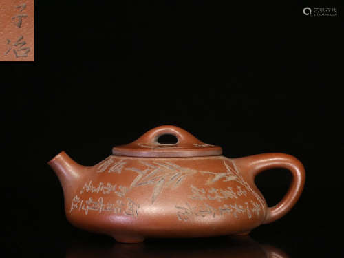 YIXING ZISHA CARVED 'BAMBOO AND INSCRIPTION' COMPRESSED TEAPOT