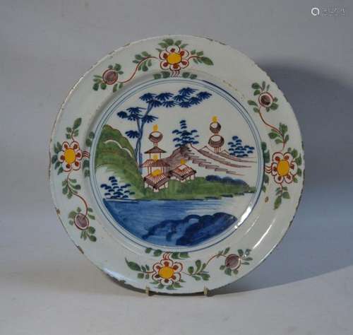 DELFT Grand plat rond en faïence à décor polychrom…