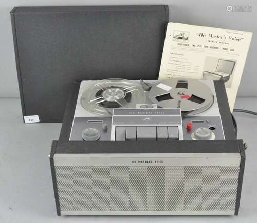 A vintage HMV His Masters Voice reel to reel tape recorder and a group of tapes