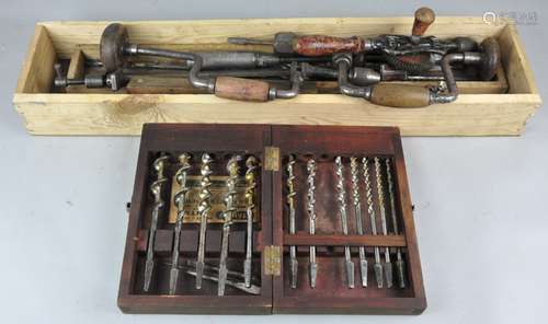 A collection of spiral screw driver drill bits and other items