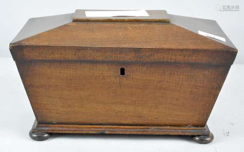 A Regency mahogany tea caddy, of sarcophagus form, with three lidded compartments,