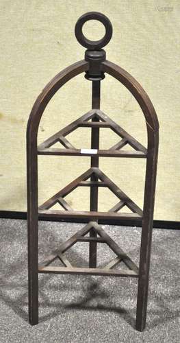 An unusual mahogany triangular three tier cake stand, with top strap handle,