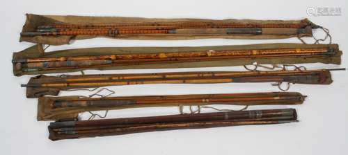 A collection of vintage fishing rods (split cane), including wooden and wooden and malacca examples,