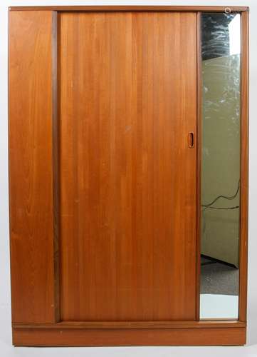 An Austinsuite style teak wardrobe with sliding door and fixed dressing mirror,