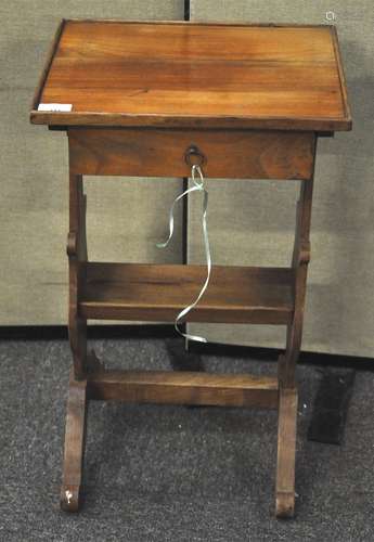 An unusual pear wood side table, having single draw to top with book trough undertier,