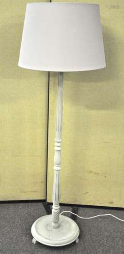 A painted wood standard lamp with fluted decoration and shade,