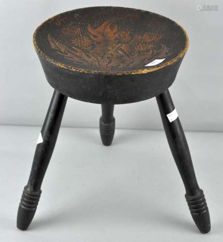 A poker work stool with three legs,