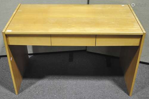 A wooden desk, three drawers and files under a sliding top,