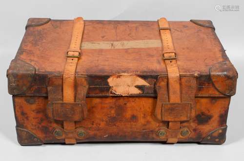 A 19th century tan leather travelling trunk with two buckle straps and lift out tray,