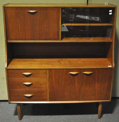 A teak wood highboard drinks cabinet raise on tapered legs,