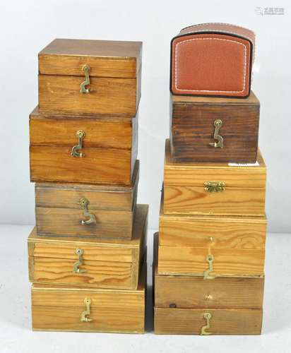 A collection of nine wooden fly fishing reel cases,