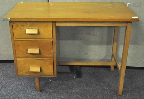 A 20th Century beech veneered desk having bank of three drawers,