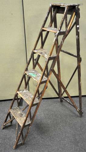 A set of wooden step ladders by Benetton