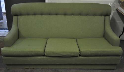 A Parker Knoll three seater sofa, upholstered in green, with sweeping arm rests, circa 1960's,