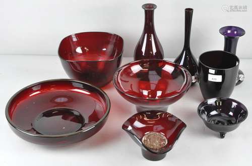 A collection of assorted ruby red glassware, to include some purple examples,