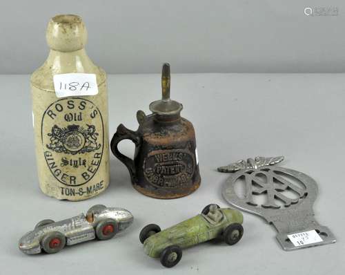 Two Dinky toys, an AA badge,