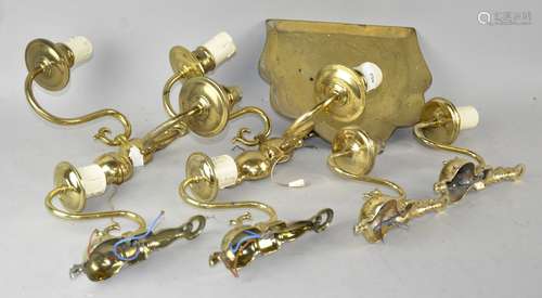 A group of brass wall lights