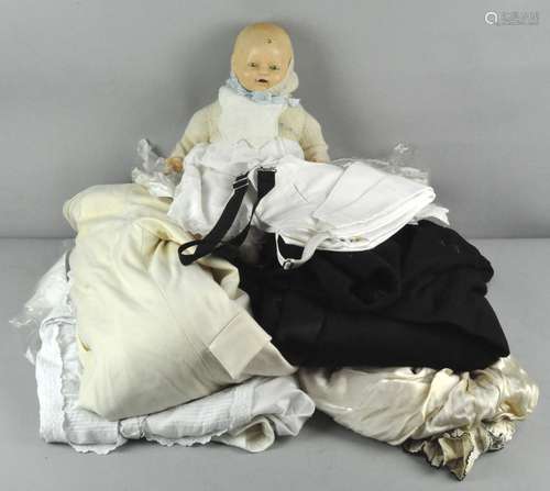 A vintage EIH Co Ltd doll with composite head along with a quantity of linen