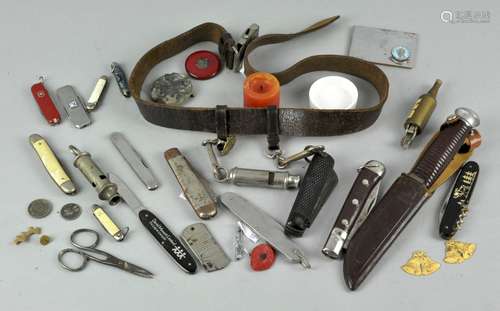 A collection of penknives and whistles