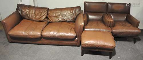 A John Lewis three piece suite comprising a vinyl sofa,