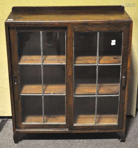 A 1940's oak and leaded glass bookcase display cabinet. Measures; 107cm x 89cm.