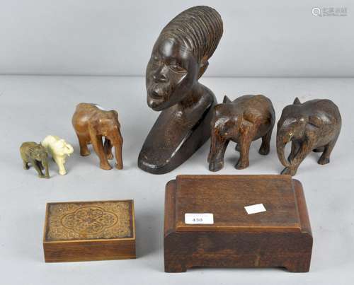 A collection of wood tribal figures, to include elephants,