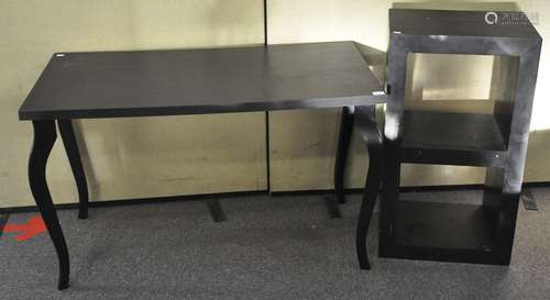 A painted table along with a small shelving/media unit,