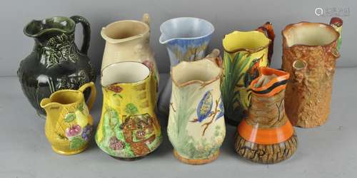 A collection of ceramic jugs to include; Arthur Wood, falcon ware and more,