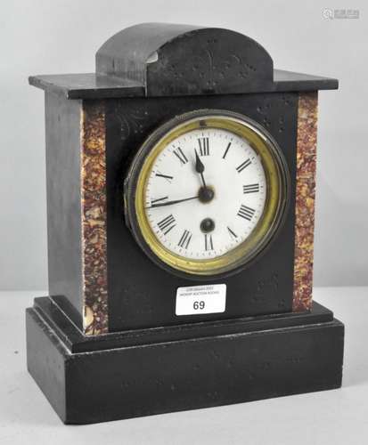 A late 19th century slate and marble mantel clock, the dial with Roman numerals denoting hours,