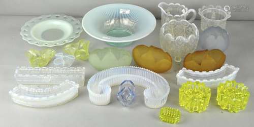 A collection of assorted early 20th century pressed and moulded glass, mostly vaseline glass,