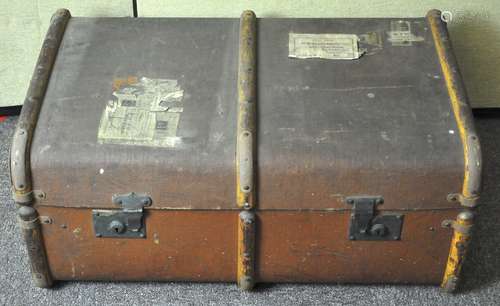 A large vintage wooden bound steamer trunk,