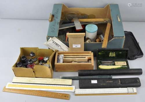 A selection of drawing equipment items to include rulers,