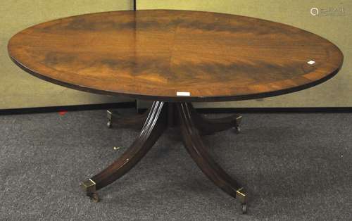 A regency style mahogany veneered oval coffee table,