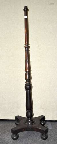 A turned mahogany standard lamp on a 19th century base,