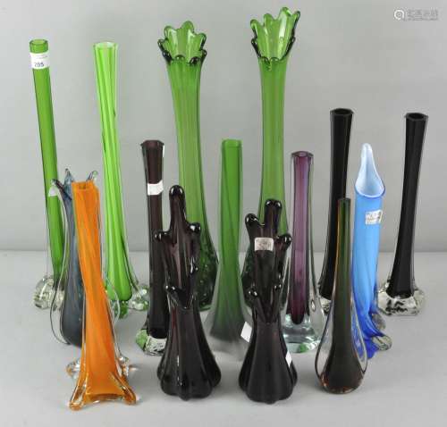 A large collection of vintage glass stem vases in various colours,