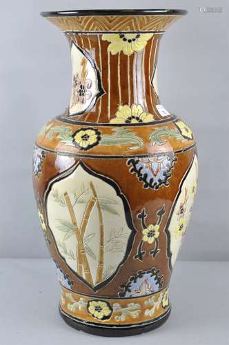 A large ceramic Oriental vase with floral cartouche decoration,