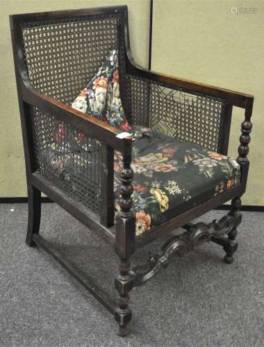 An early 20th century Bergere upholstered armchair,