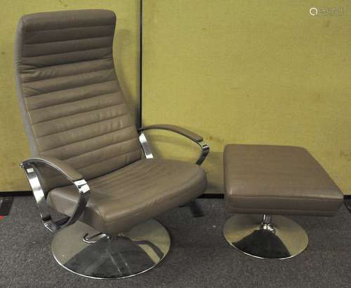 A modern reclining armchair and stool, in beige faux leather upholstery and chromed frame.